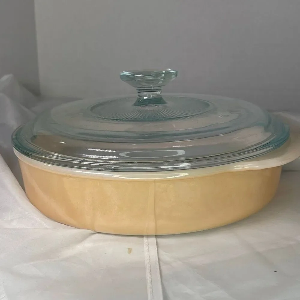 Vintage Fire King Peach Luster Casserole dish with glass lid.